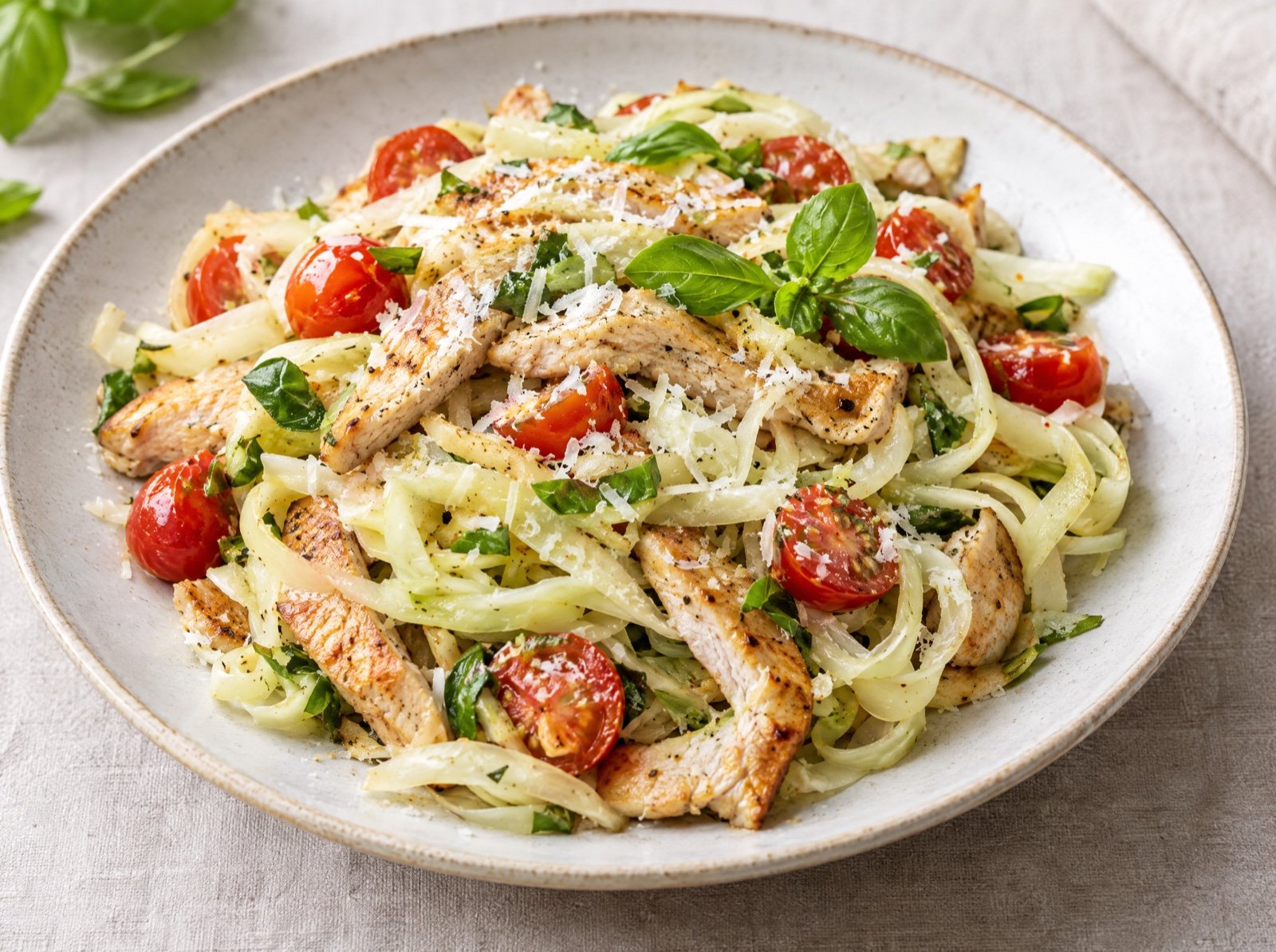 Kohlrabi Ribbon Noodles with Turkey Strips and Tomato Basil